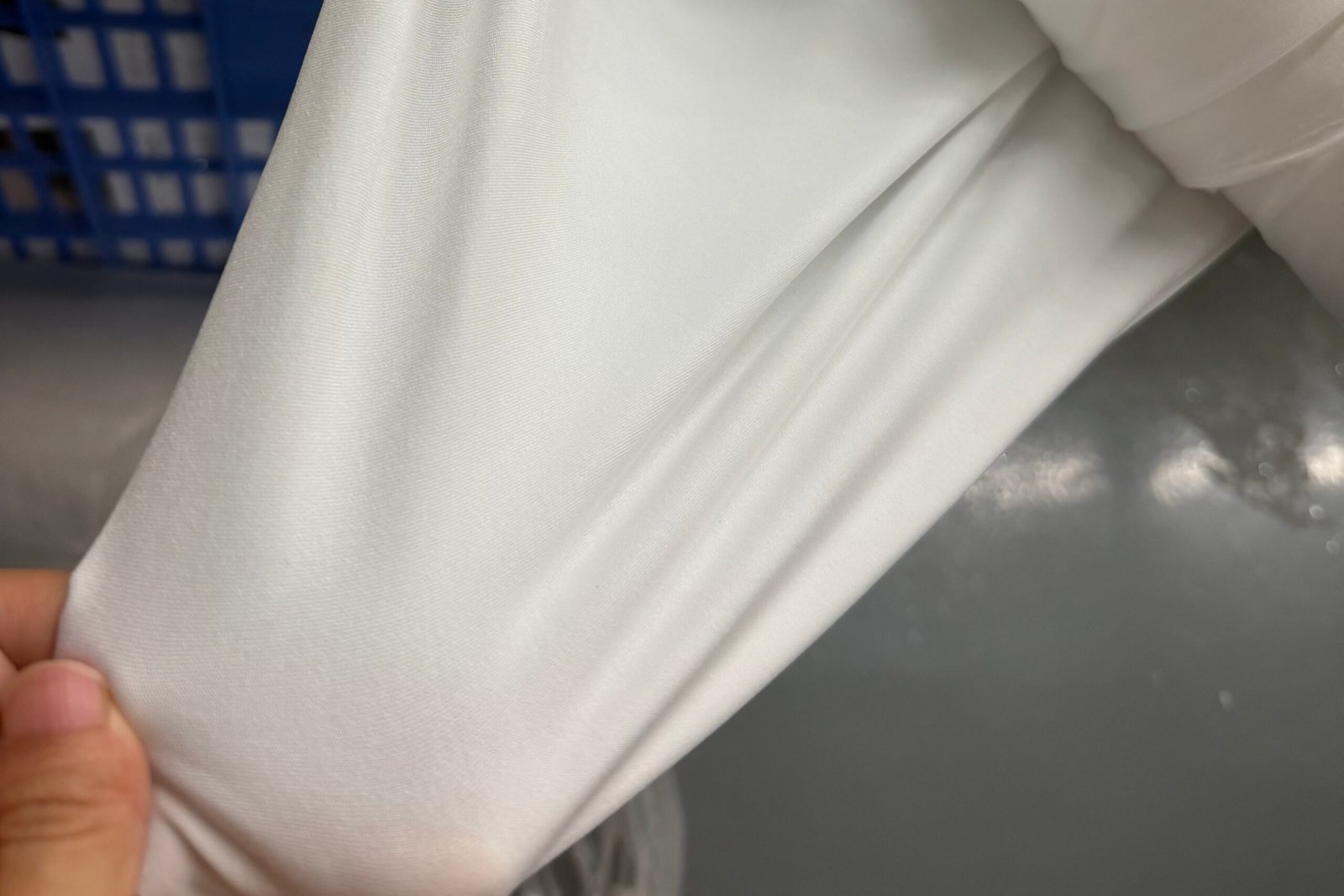comparison of stain visibility on satin versus textured wedding dress fabric