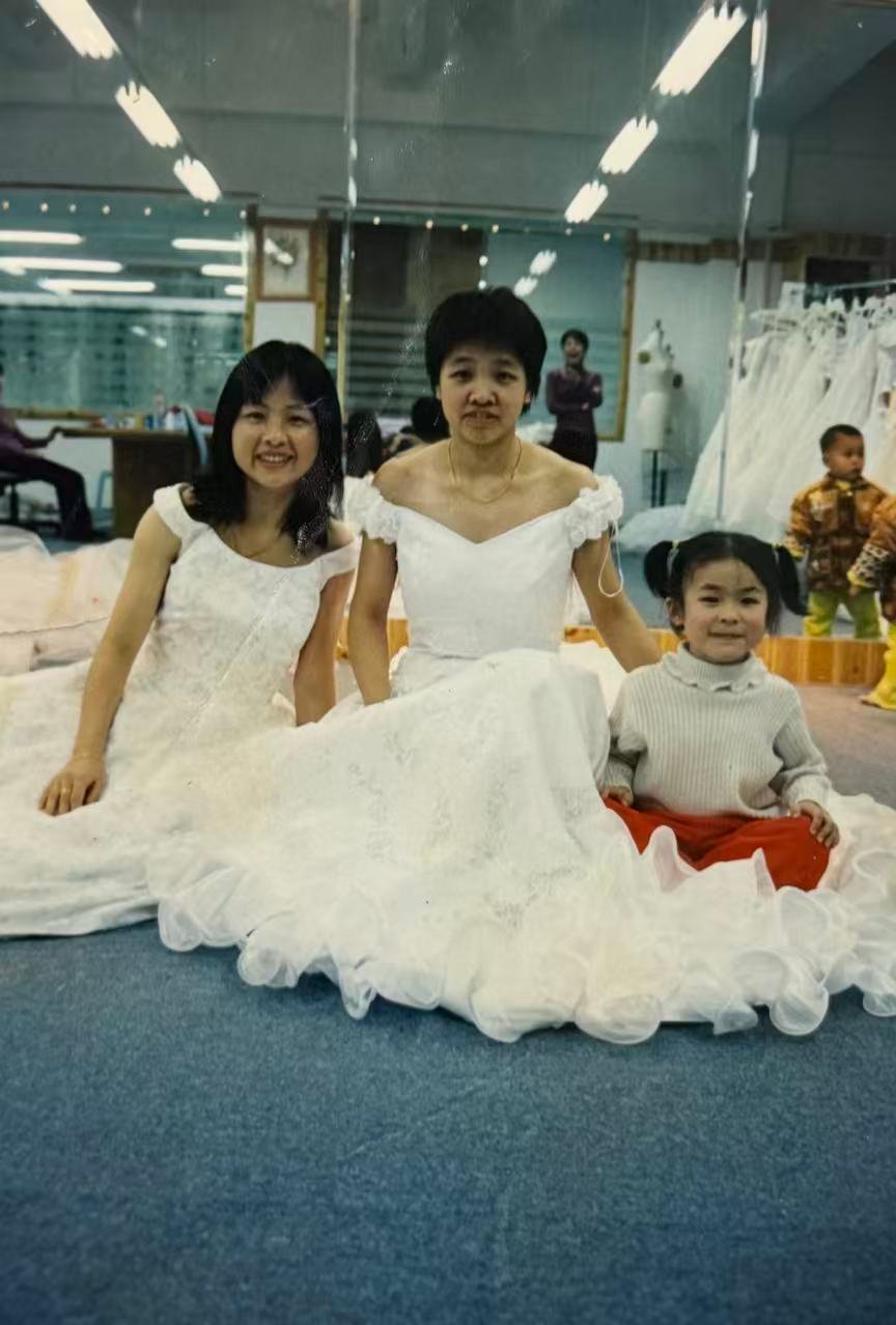 Mother and daughter working together in the bridal atelier